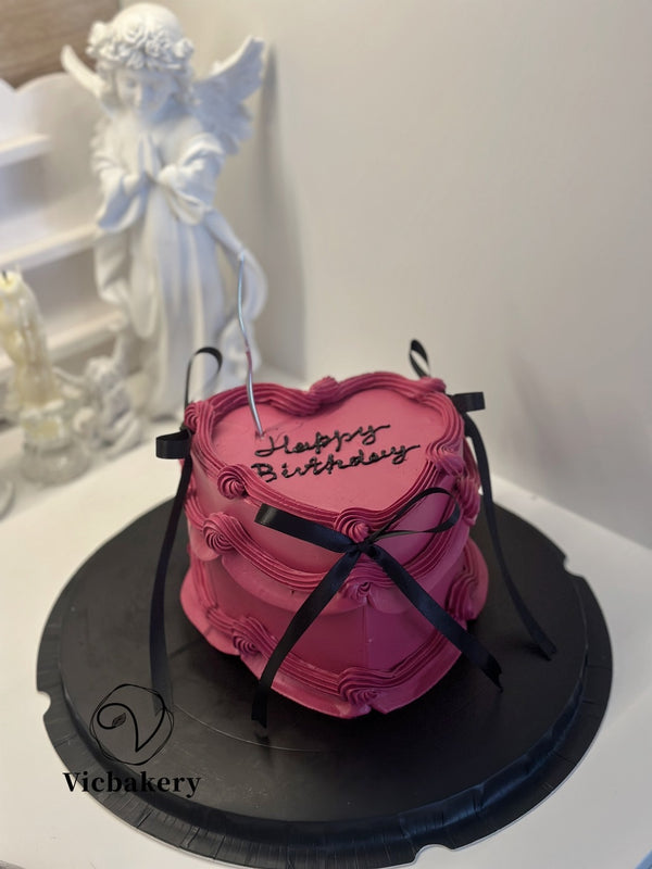 Heart shape Cake in red with black bow